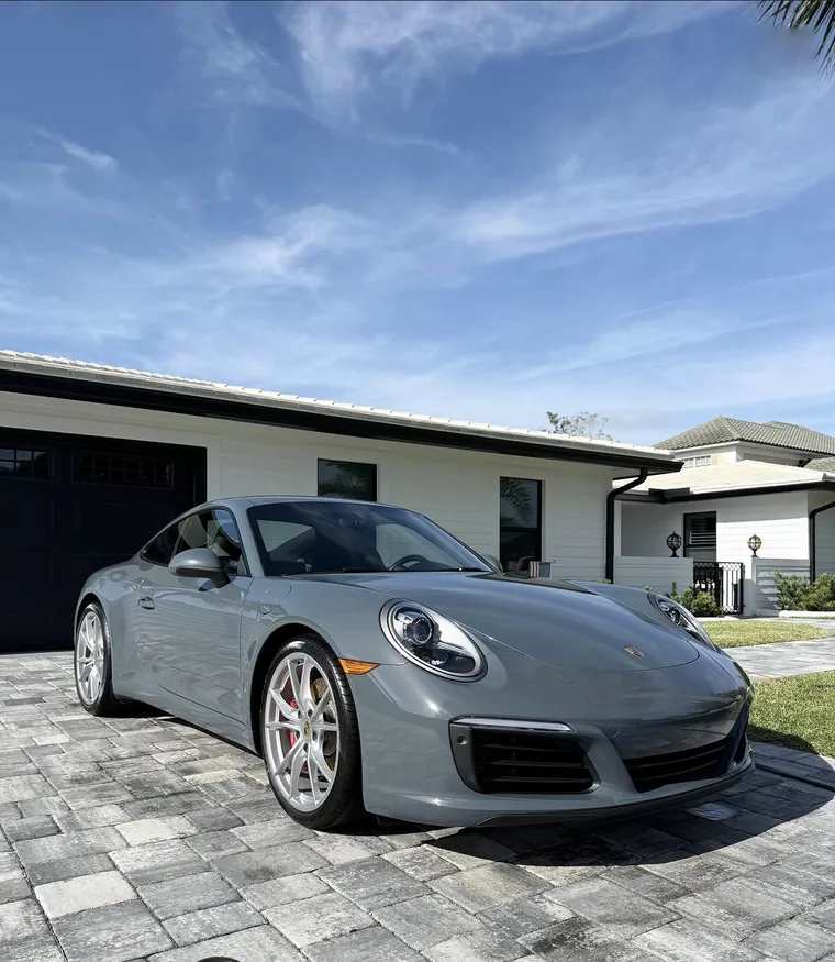 A grey Porsche 911 kept clean on an A2D maintenance schedule.