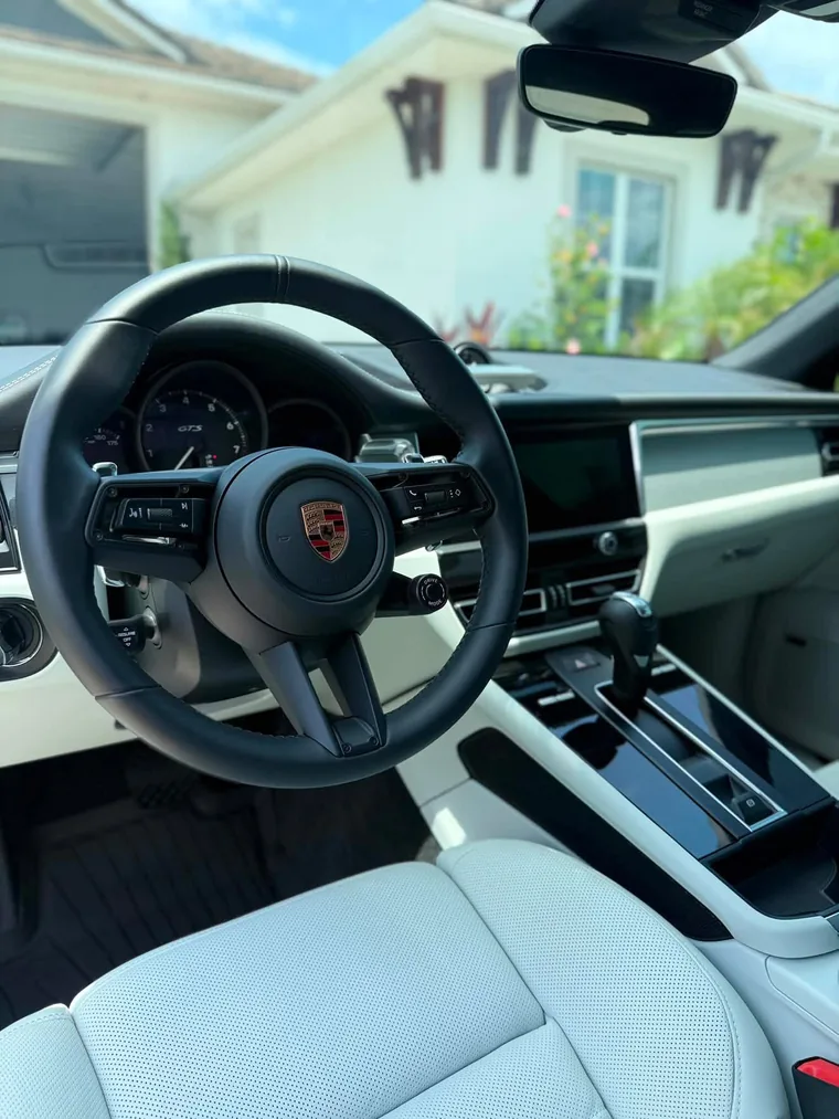 A Porsche cockpit and chalk leather interior after an A2D full detail.