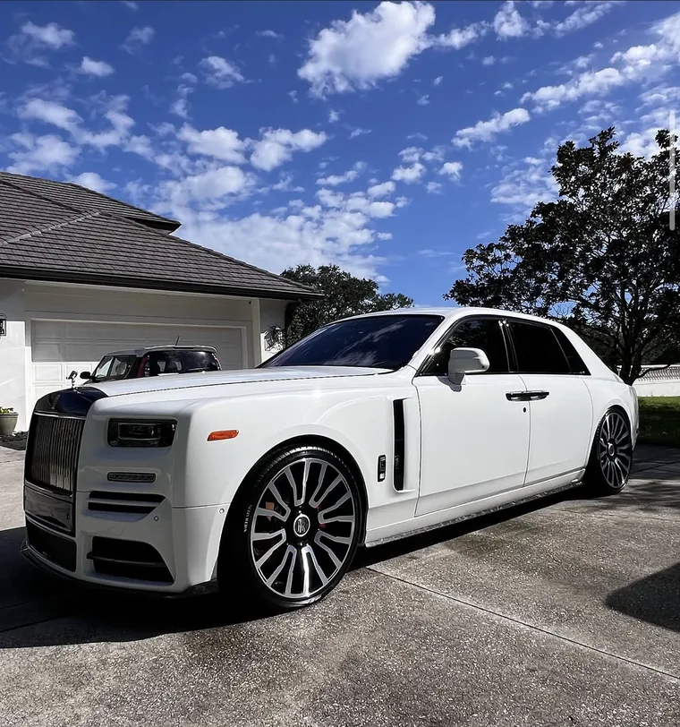 White Rolls-Royce Phantom on Mansory wheels in a driveway after a full exterior detail by A2D.